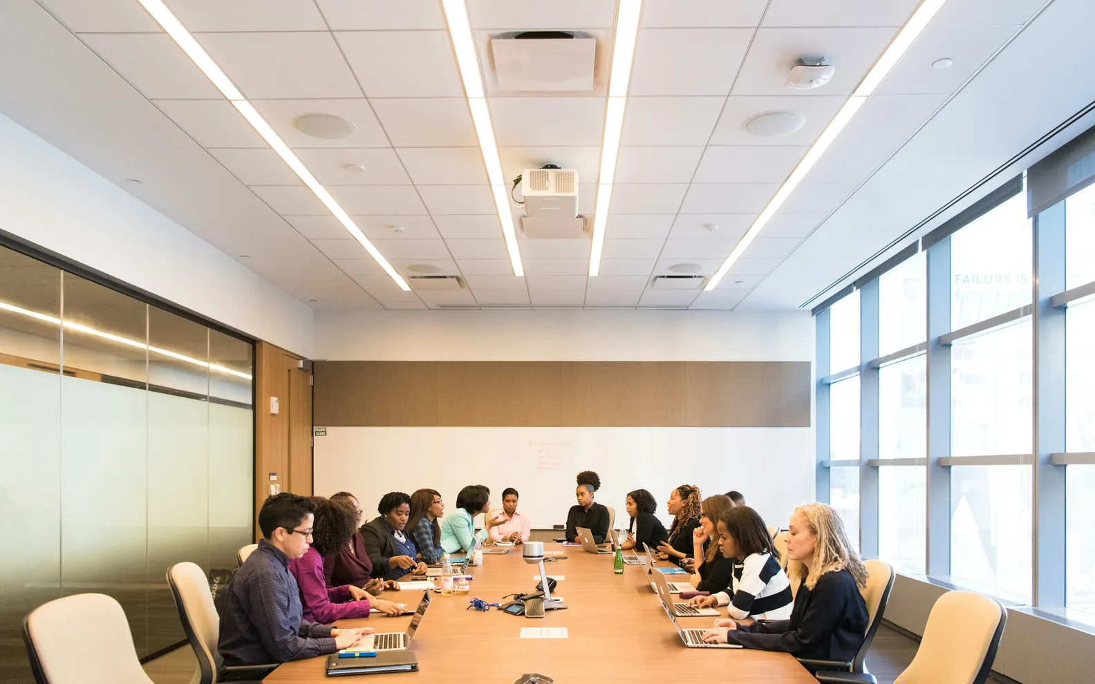 Colleagues reflecting together around a conference table.